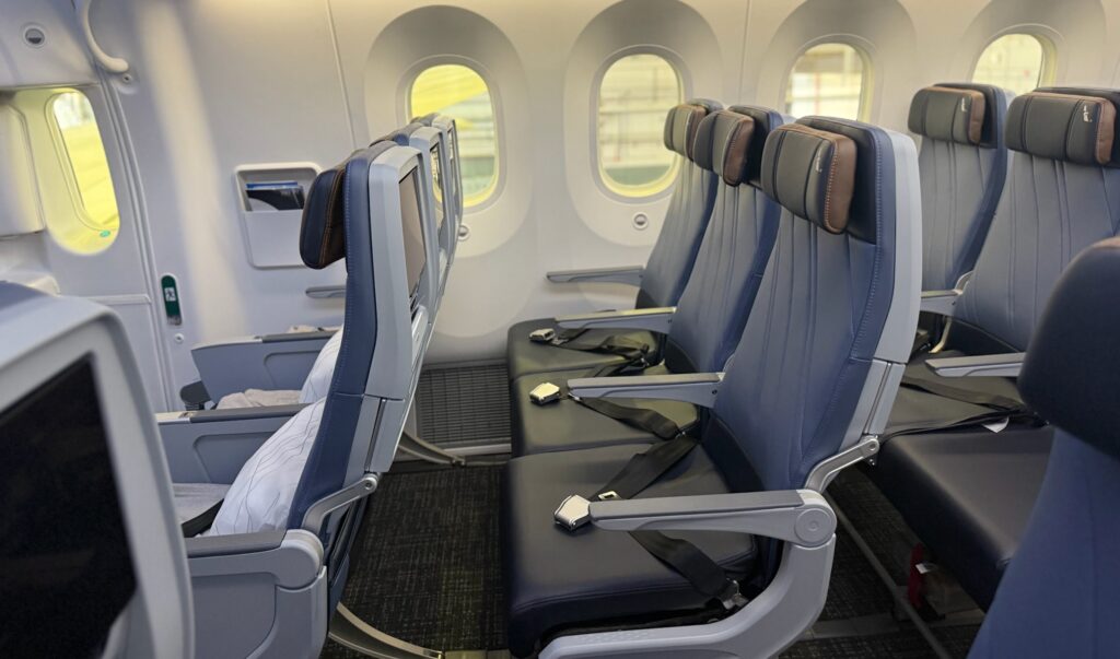 Side view of American Airlines extra-legroom economy class seats.